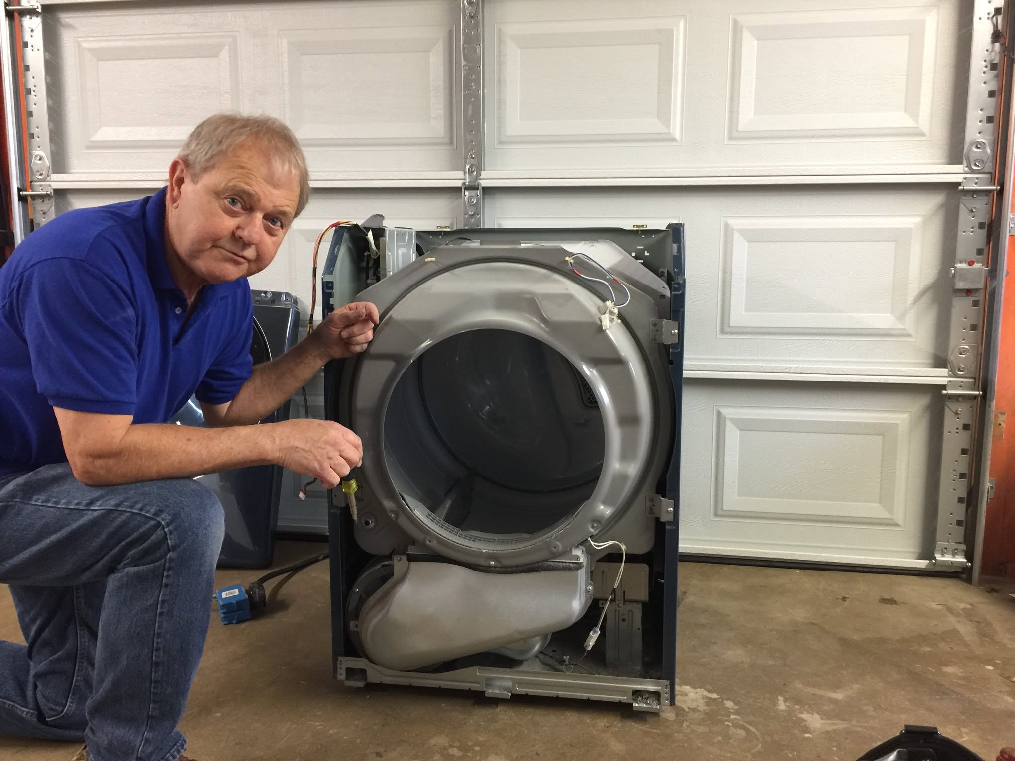 Raney Appliance Repair technician working on a dryer